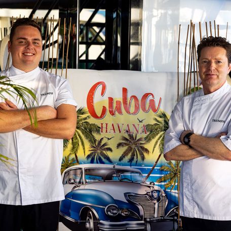 Two chefs photographed at the Antigua Charter Yacht Show Chef Competition