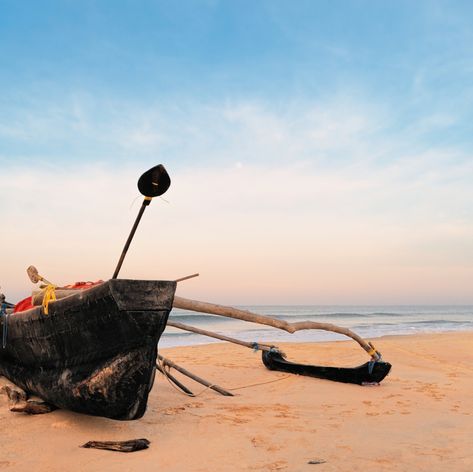 Old fishing boat on empty beach