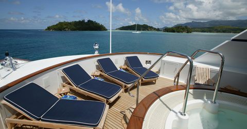 Jacuzzi and sun loungers on sun deck of superyacht TELEOST