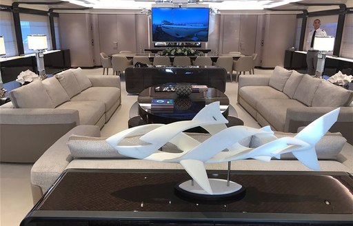 o'pari superyacht main salon with statue and sofas 