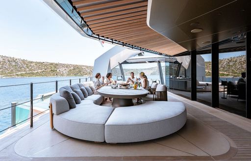Charter yacht THIS IS IT exterior seating area and charter guests
