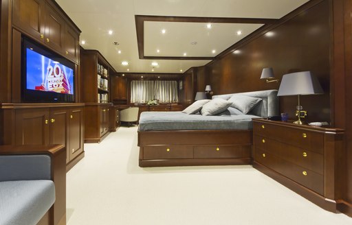 bed and tv in master suite of luxury yacht Axantha II 