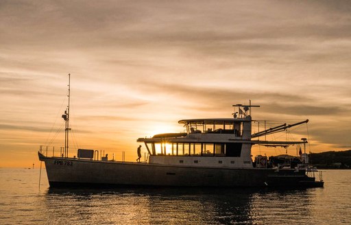 Explorer yacht in action the luxury superyacht Grey Wolf captured in the sunset 