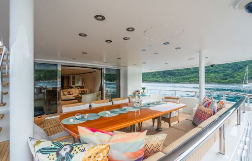 Alfresco dining setup onboard charter yacht SERENITY