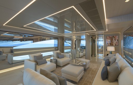 Comfortable pale seating and interior on superyacht EIV