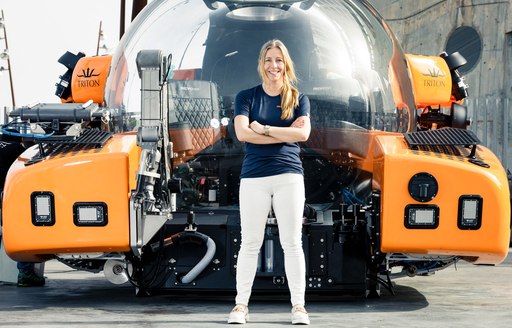 Nina Jensen stands next to the new REV Ocean submersible AURELIA unveiled in Barcelona