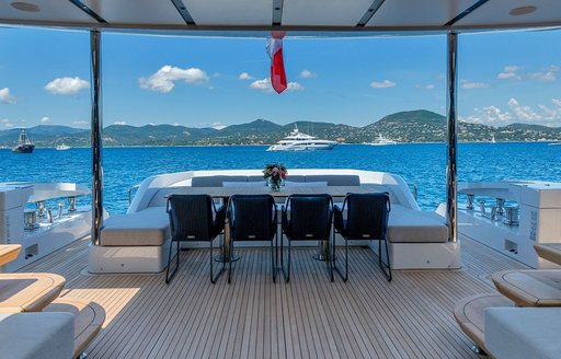 Line of four seats on upper deck of charter yacht ARSANA