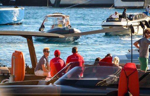 yacht crew on tender in port hercules marina