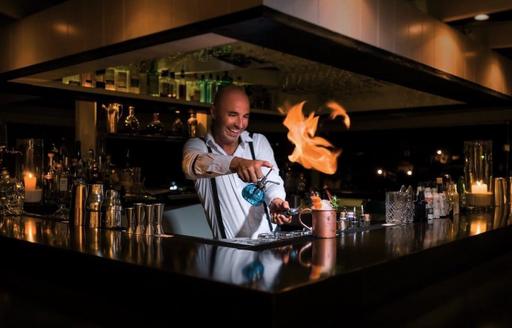 Chef at Bonito with fire in pan