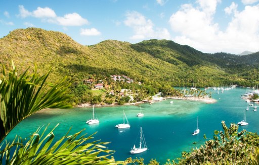 caribbean bay with little boats on the water