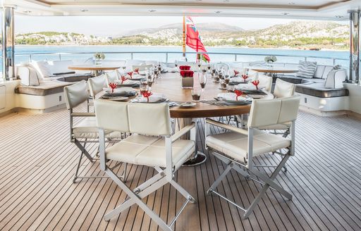 Exterior dining arrangement onboard charter yacht ELENI