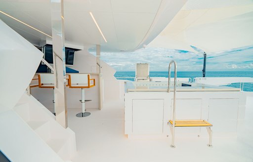 Deck Jacuzzi and a wet bar on the aft deck onboard luxury yacht rental SEA-RENITY