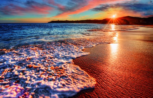 A beach in the Bahamas at sunset 