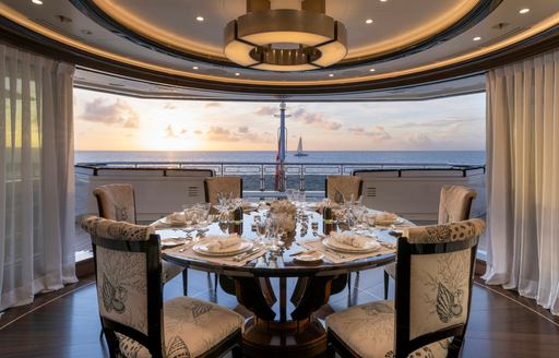 Charter yacht ALFA NERO interior dining area and large window