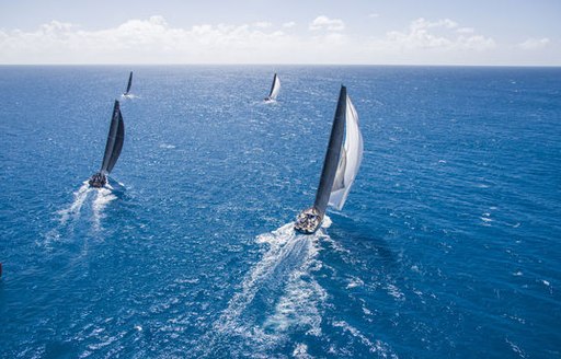 yachts cut through the sparkling waters at the RORC Caribbean 600 