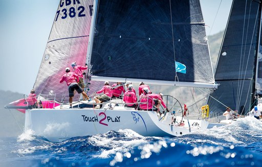 Sailors in pink on the water in the British Virgin Islands