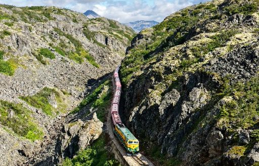 White Pass & Yukon Route Railway train going through mountains