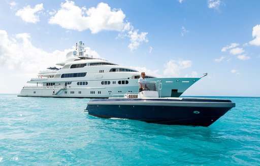 superyacht TITANIA at anchor alongside custom tender