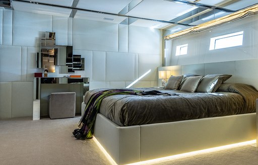 Double bed and light furnishings on motor yacht Cinquanta 50