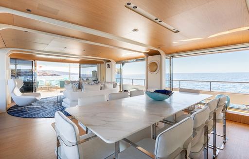 Charter yacht PH2 dining area with adjacent windows