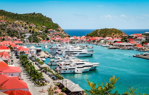 Gustavia Harbor in St Barts with many motor yacht charters berthed