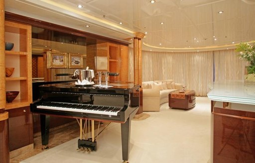 The piano in the main salon of luxury yacht Lady Lola