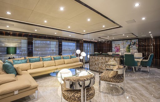 main salon on luxury yacht happy me, with soft furnishings and large sofas