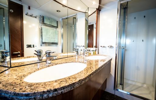 marble his and hers sinks on charter yacht chess