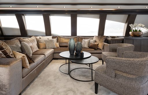 Interior lounge area onboard charter yacht BAGHEERA with extensive glazing 