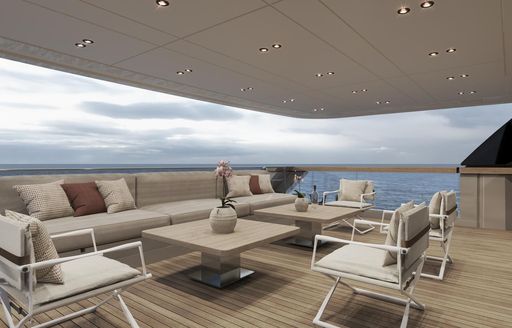 Exterior rendering of seating area with cream sofas and white chairs onboard charter yacht ANDIAMO