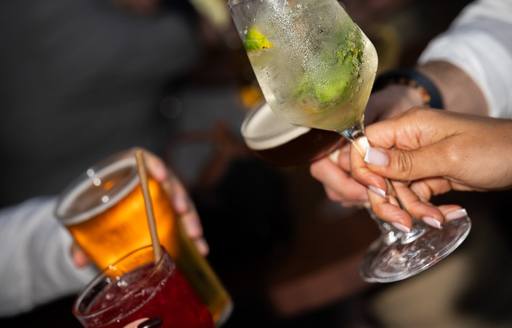 Group of people toasting cocktails
