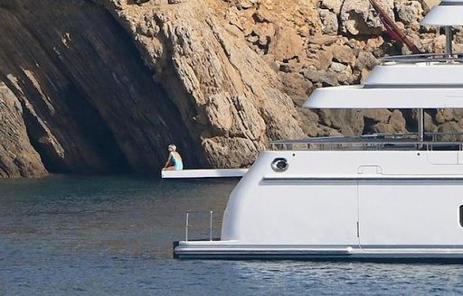 Elizabeth Debicki recreating iconic image of Diana on the end of the diving board of yacht Bash (ex-Jonikal) in 1997 in Portofino