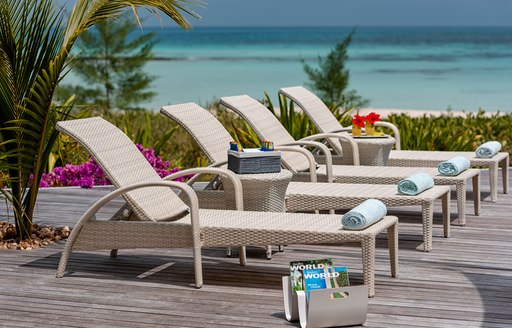 sun loungers next to pool on thanda island