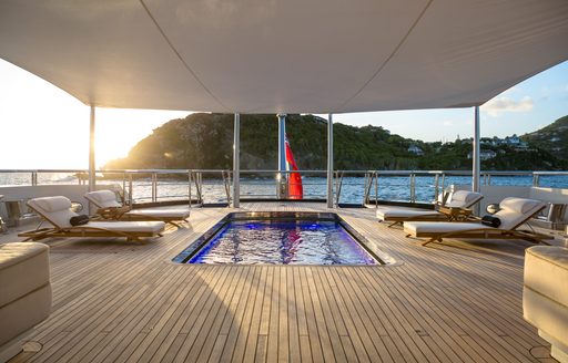 Swimming pool and loungers onboard charter yacht BLACK PEARL