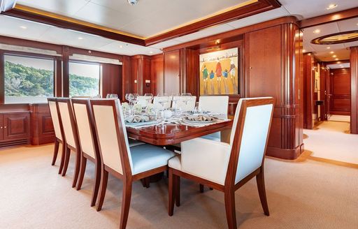 Charter yacht TIREA interior dining table with large windows