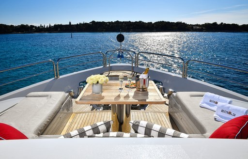 Bridge deck seating area on board luxury yacht EMOJI