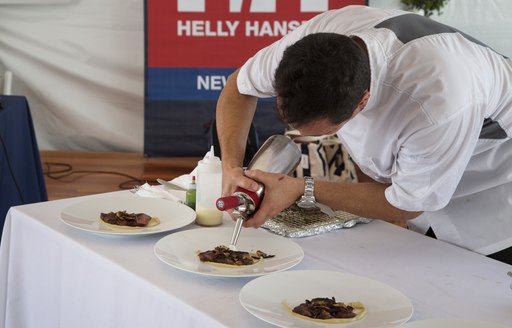 Chef Daniele Messina preparing dishes at the Newport Charter Show 2017