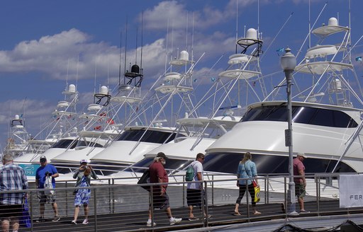 sportfishers at palm beach, with attendees walk past on bridge