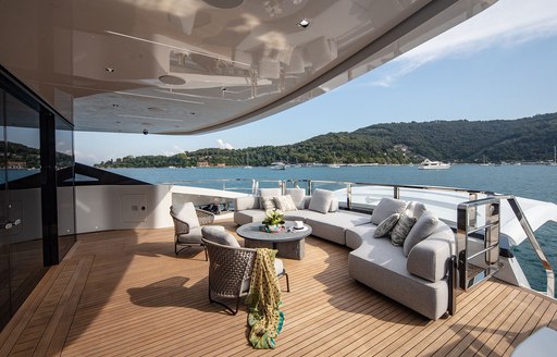 Aft deck seating on superyacht MA, with sea views in background