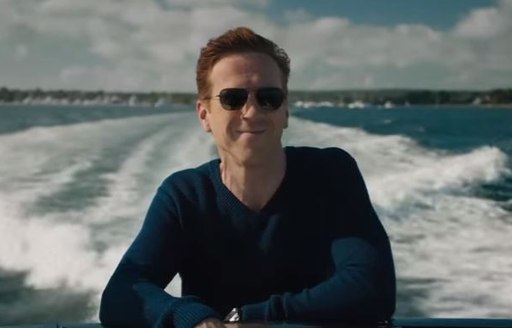 Axe, played by Damien Lewis, approaches his superyacht on a tender