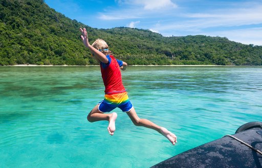 water park child jumping into water