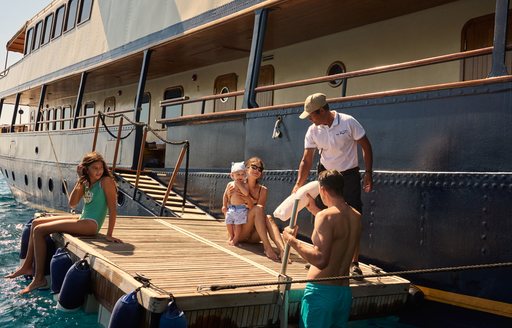 Swim platform onboard charter yacht SEAGULL II with charter guests and crew 