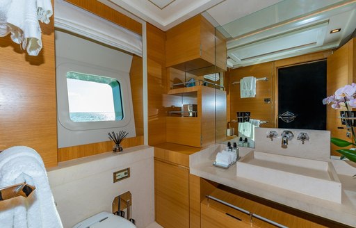 Charter yacht DB9 ensuite with sink and small window