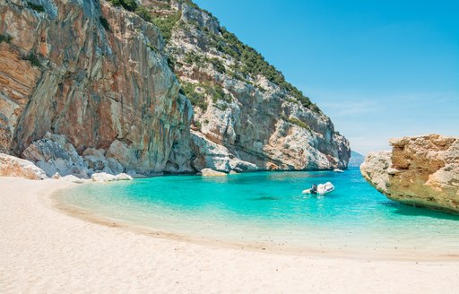 White sandy beach in cove in Sardinia