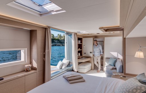 Master suite with light streaming in aboard luxury charter catamaran Double Down