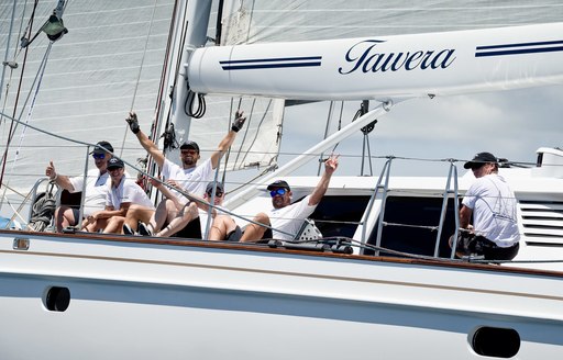 crew wave on board sailing yacht TAWERA during the NZ Millennium Cup 