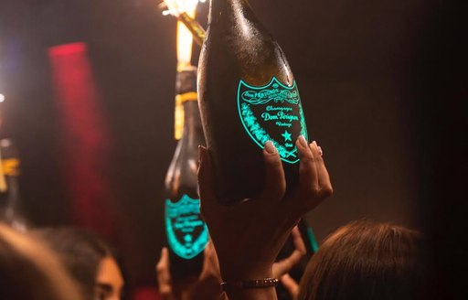 Elevated champagne bottles with fireworks attached