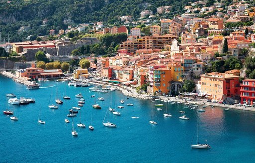 Superyachts sat close to the French coastline