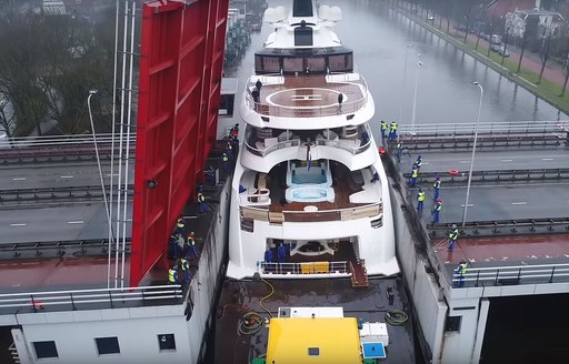 Aft decks of luxury yacht Lady S as she passes between bridge