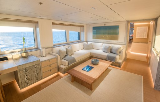 amels charter yacht driftwood clean  and neutral interiors in office area